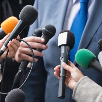 Microphones on a press conference.